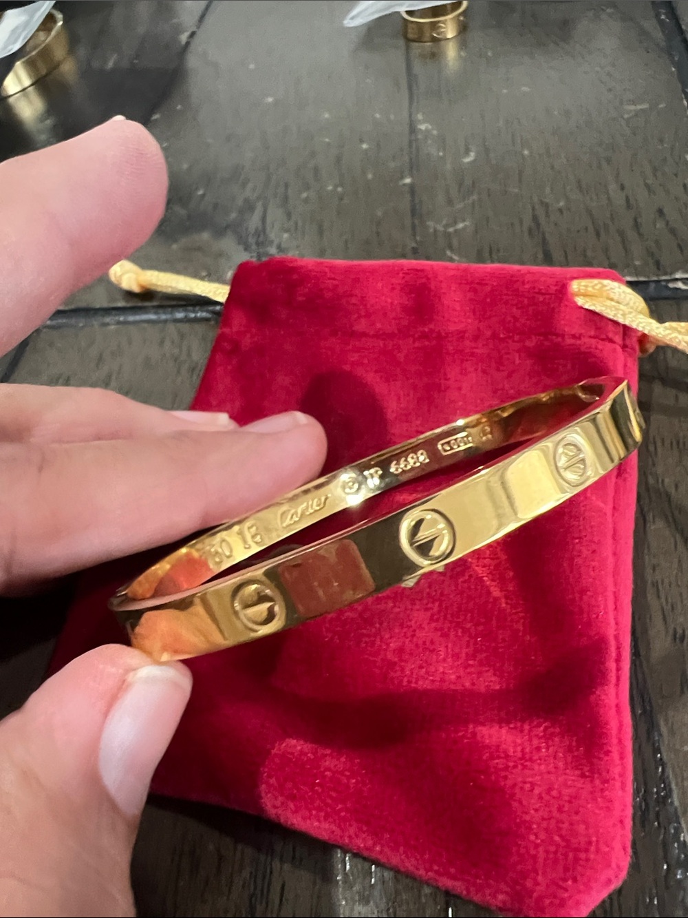 Gold Motif Bracelet with Red Pouch